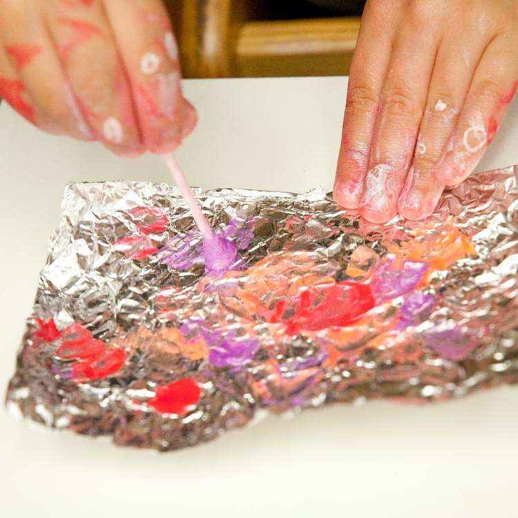 Toddler Fingerpainting on Tinfoil